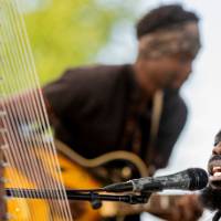 Singer and guitarist performing together
